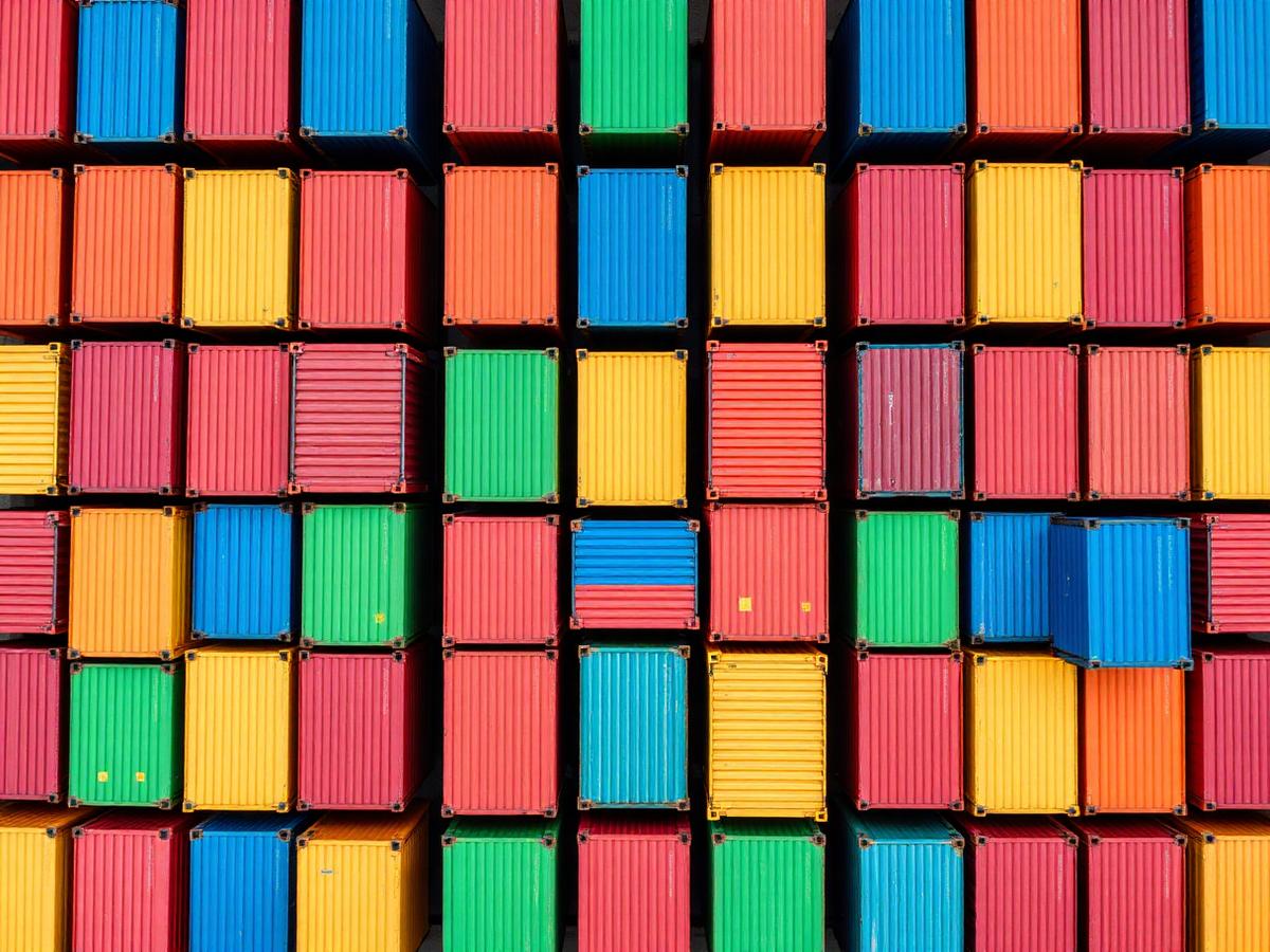 Grid of colorful shipping containers seen from above